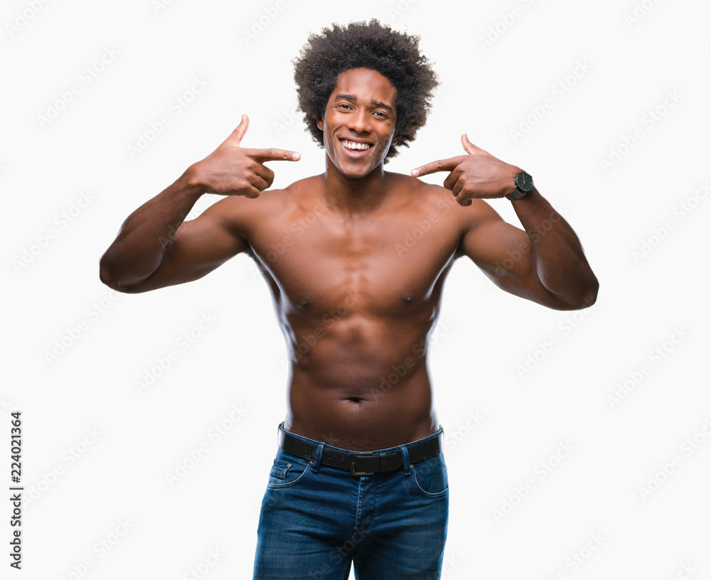 Afro american shirtless man showing nude body over isolated background smiling confident showing and pointing with fingers teeth and mouth. Health concept. Afro american shirtless man showing nude body over isolated background smiling confident showing and pointing with fingers teeth and mouth. Health concept.