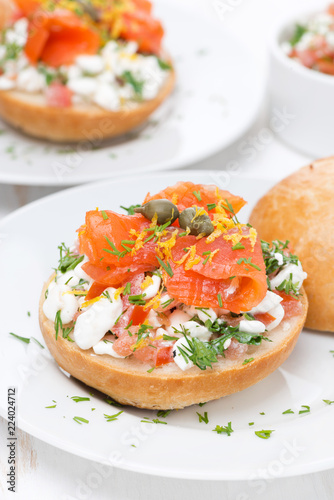 sandwich with cheese, tomato and salmon, vertical
