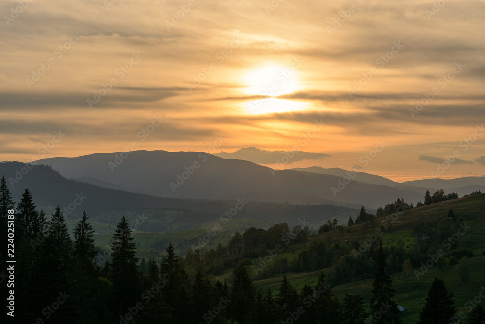 Sunset in the forest and mountains in the Ukrainian Carpathians