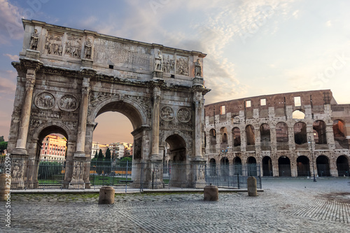 The Colosseum and The Arch of Constantine view with colorful sky and no people