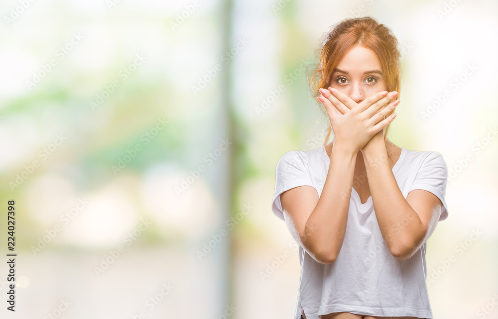 Fototapeta premium Young beautiful woman over isolated background shocked covering mouth with hands for mistake. Secret concept.