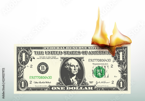 Symbole de la crise économique et monétaire, avec un billet de un dollar qui flambe