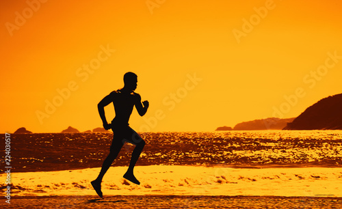 Silhouette of a runner at sunset with copy space as symbol for sport