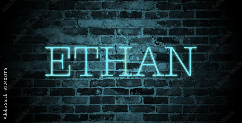 first name Ethan in blue neon on brick wall first name Ethan in blue neon on brick wall