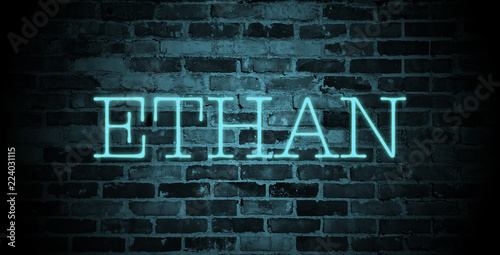 first name Ethan in blue neon on brick wall photo