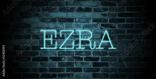 Fotomural first name Ezra in blue neon on brick wall