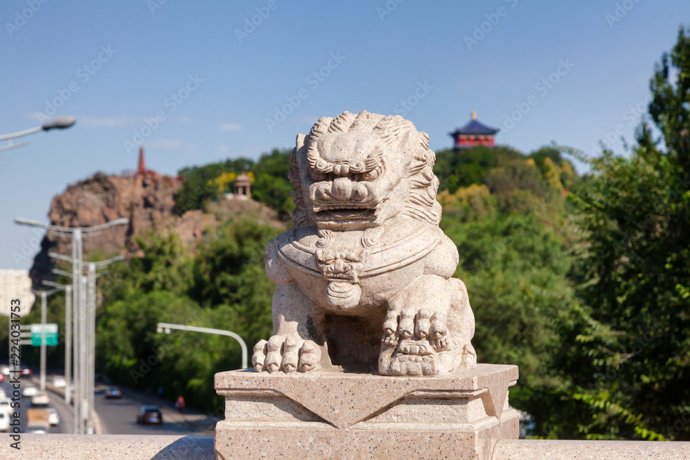 Stone lion on Xi Daqiao Bridge Urumqi Xinjiang China