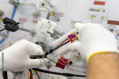 фотографія Checking the wiring systems on the control desk, checkpoint, automotive industry
