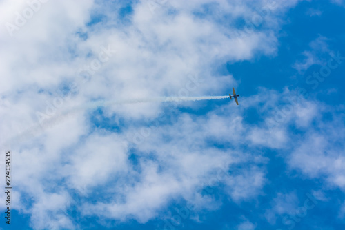 A Plane Flying Towards the Clouds at an Airshow
