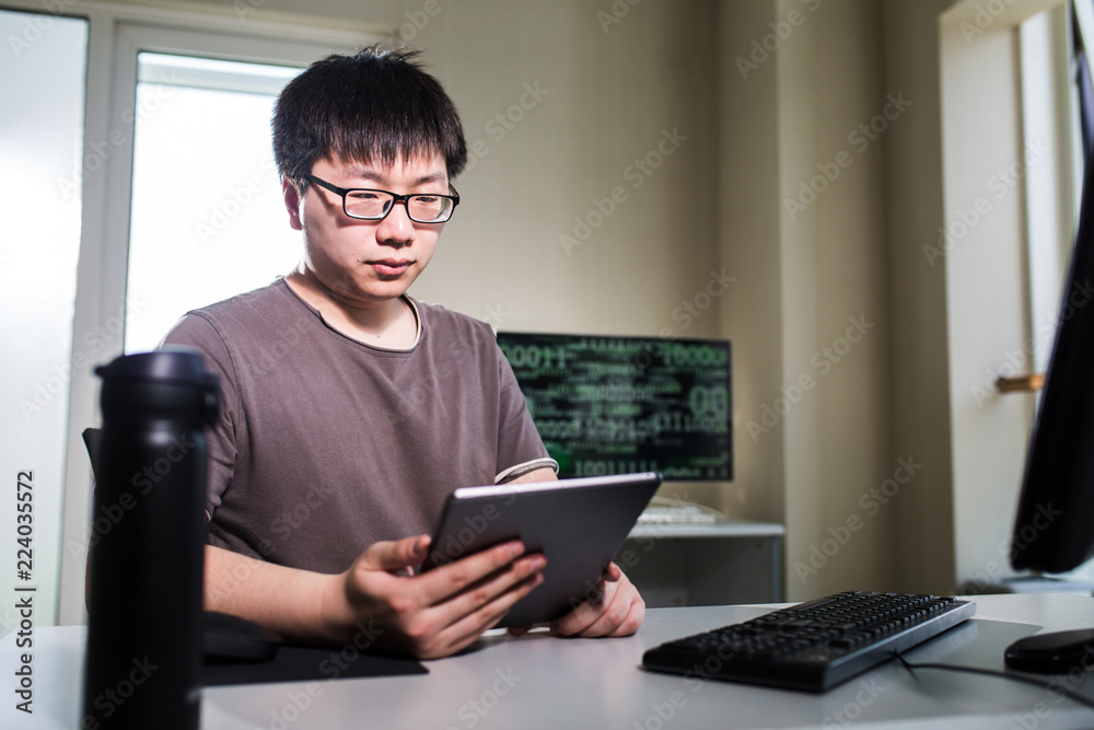 young man working with computer young man working with computer