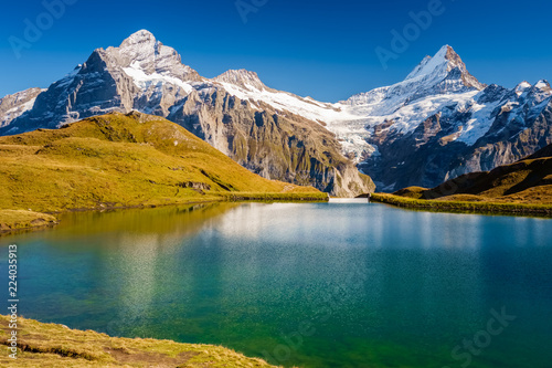 Encountering Bachalpsee during the famous hiking trail from First to Grindelwald  Bernese Alps  Switzerland . You can have great views on mountains like the Eiger  Monch and Jungfrau.
