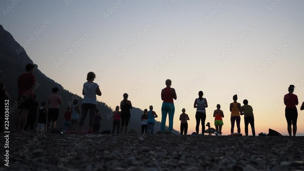 Sunrise silhouette Yoga on the beach Turkey