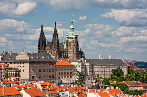 Aerial view of the city. St. Vitus Cathedral over old town red roofs. Prague, Czech Republic