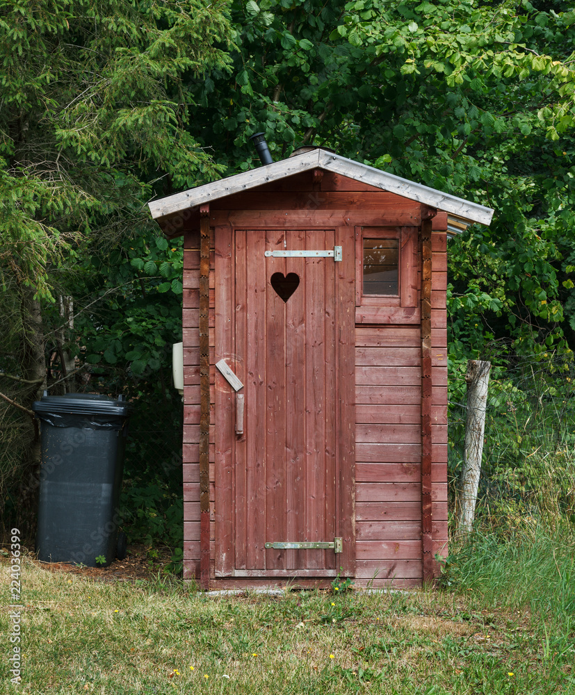 Small red outside toilet. Small red outside toilet.