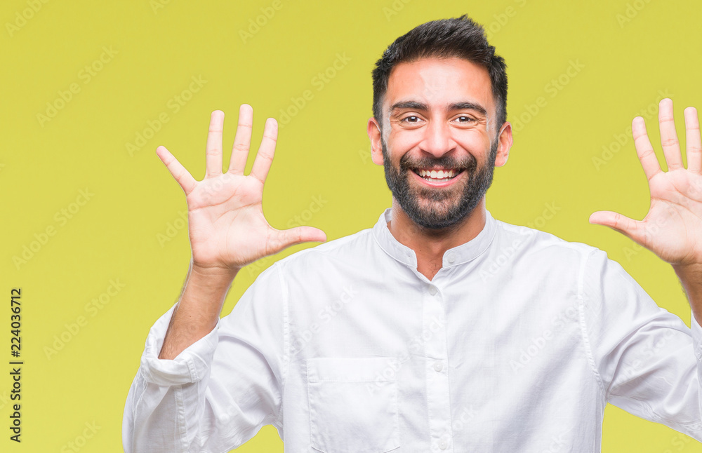Fototapeta premium Adult hispanic man over isolated background showing and pointing up with fingers number ten while smiling confident and happy.