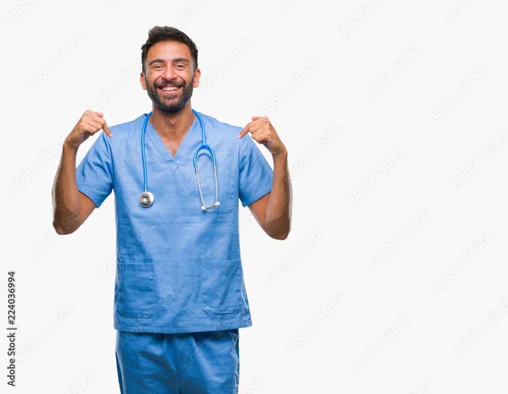 Adult hispanic doctor or surgeon man over isolated background looking confident with smile on face, pointing oneself with fingers proud and happy. Adult hispanic doctor or surgeon man over isolated background looking confident with smile on face, pointing oneself with fingers proud and happy.