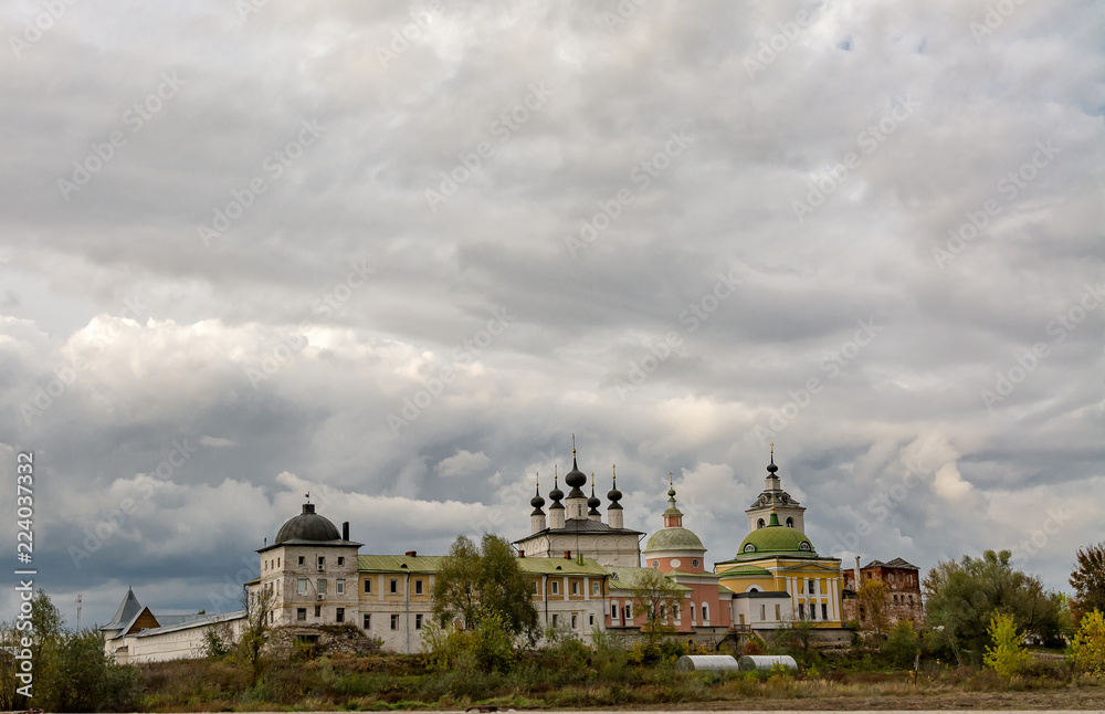 Holy Trinity Belopesotsky Convent in the cloudy autumn afternoon in a distance