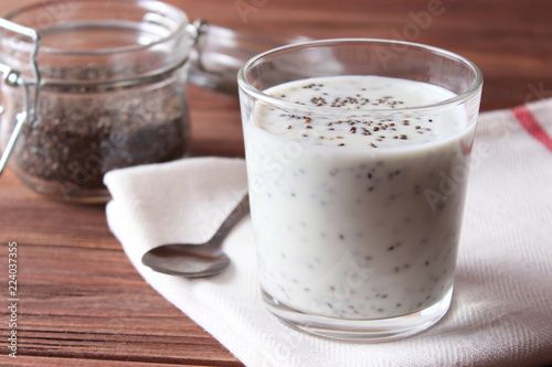 chia pudding with yogurt on a wooden background. A simple recipe for proper nutrition, useful supplements, super food