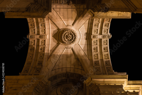 The amazing city of Lisbon, Portugal at night. Details of Praca do Comercio. photo