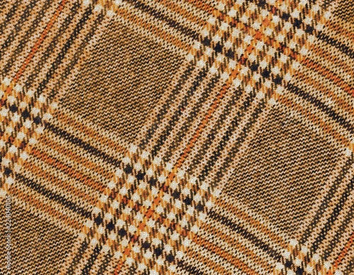 Tartan laineux orange et brun pour fond.