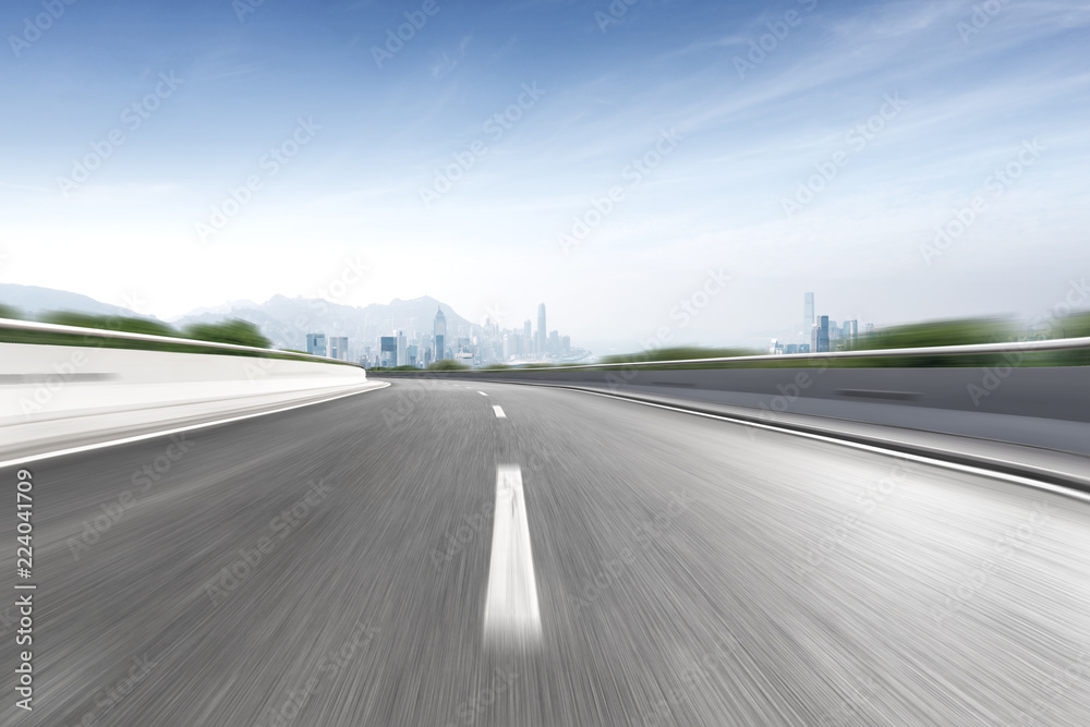 empty highway through modern city empty highway through modern city