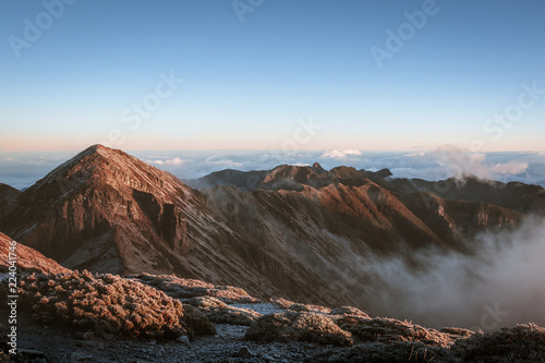 Amazing sunrise on the cloudy mountain ridge view