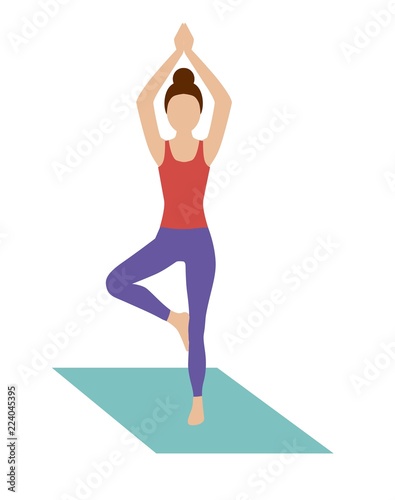 woman doing yoga in a pose tree