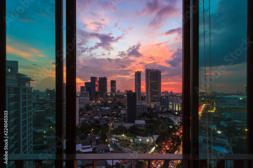 Fototapet Glass window in room with view at beautiful sunset