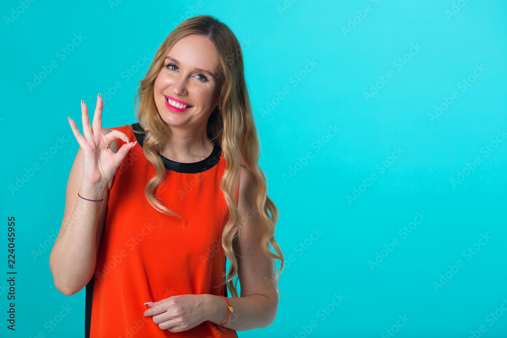 beautiful young girl with her hair on a blue background beautiful young girl with her hair on a blue background