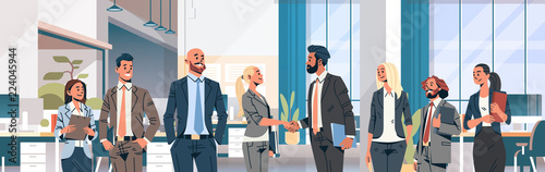 business people group hand shake agreement communicating concept modern coworking office interior men women partnership male female cartoon character portrait horizontal banner flat vector