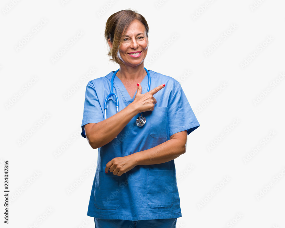 Nurse smiling pointing to the side over isoalted background Nurse smiling pointing to the side over isoalted background