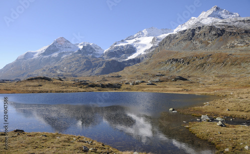 Tourist attraction: Glacier lake in the swiss alps mountains on Bernina in the Engadina