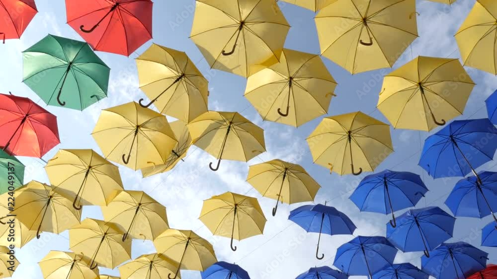 Relaxing movements of parasols in the rows. Colorful umbrellas on the wind. Slider shot
Relaxing movements of parasols in the rows. Colorful umbrellas on the wind. Slider shot