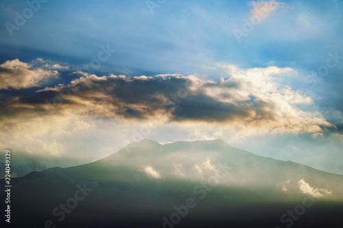 Etna volcano with clouds surrounding the mountain top