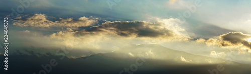 Etna volcano with clouds surrounding the mountain top