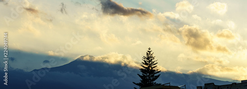 Etna volcano with clouds surrounding the mountain top