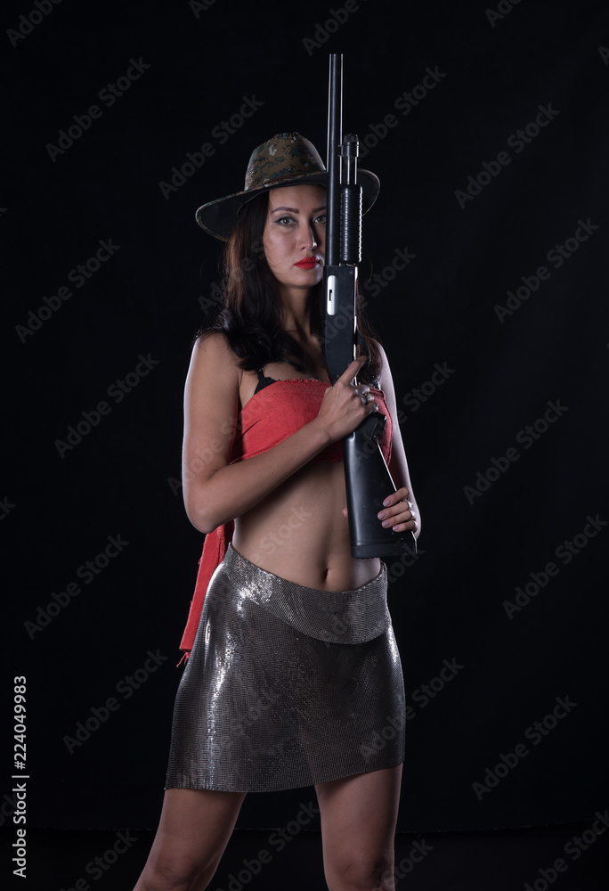 beautiful sexy girl with shotgun, studio portrait beautiful sexy girl with shotgun, studio portrait