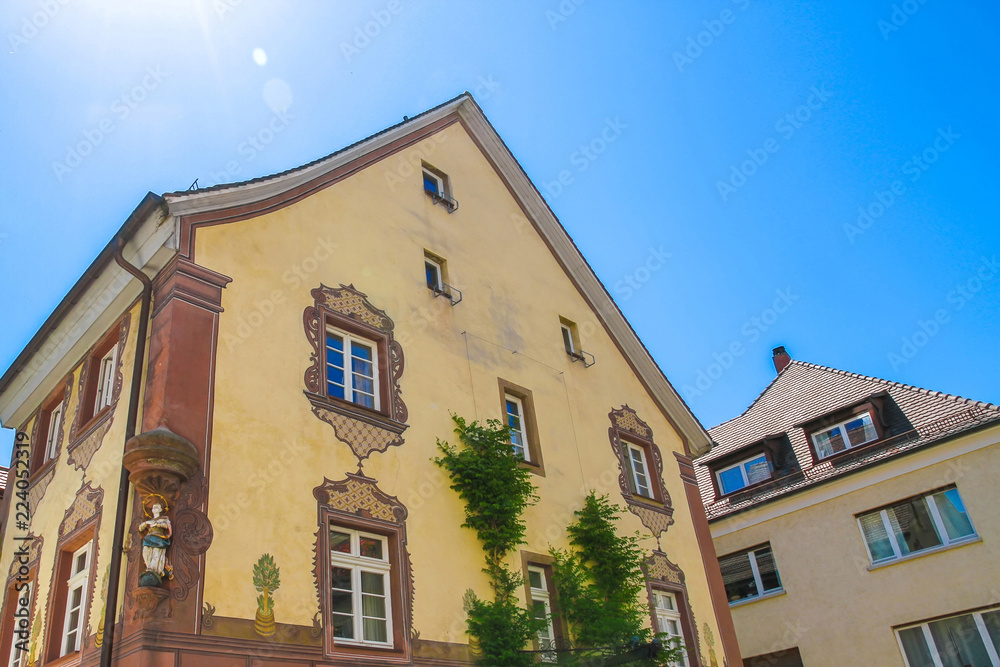 View on the historic architecture in Freiburg im Breisgau, Germany on a sunny day. View on the historic architecture in Freiburg im Breisgau, Germany on a sunny day.