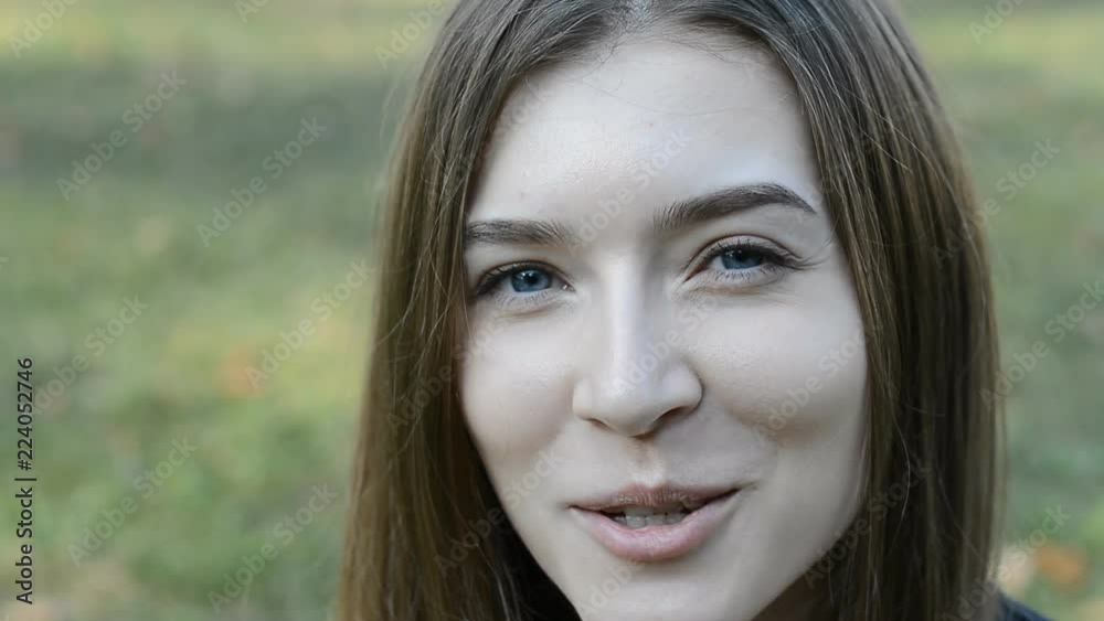 portrait of a smiling young woman talking portrait of a smiling young woman talking