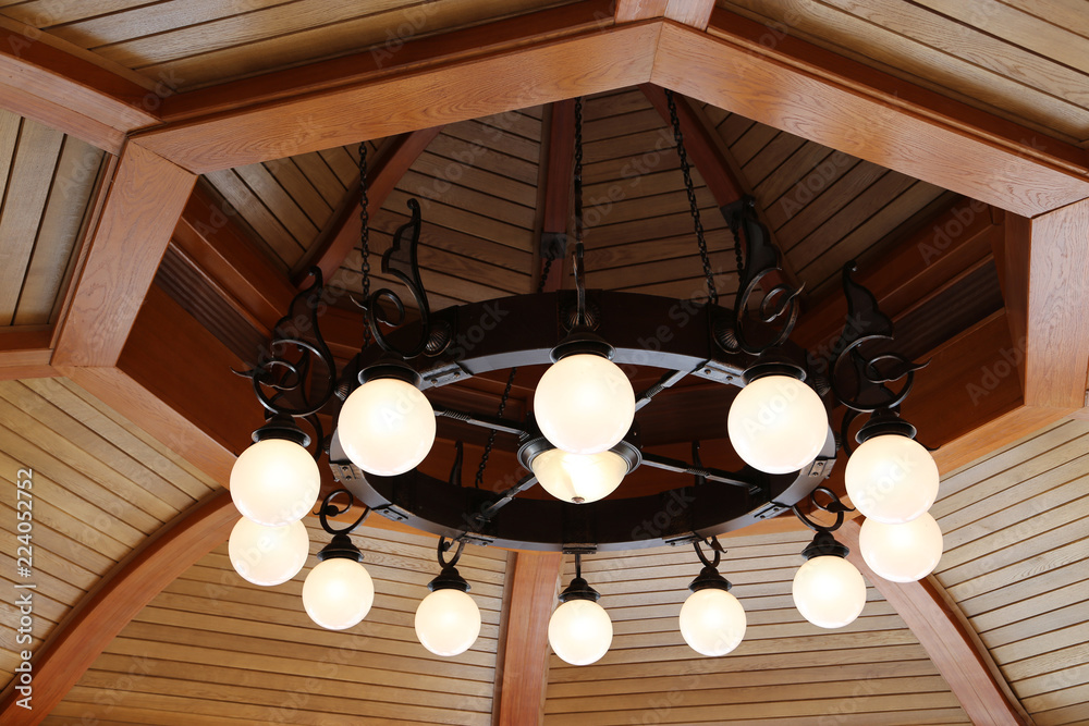 chandelier on a wooden ceiling