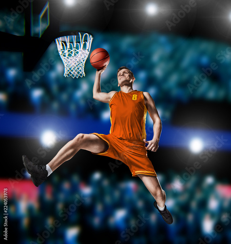basketball player making slam dunk on basketball arena © 27mistral