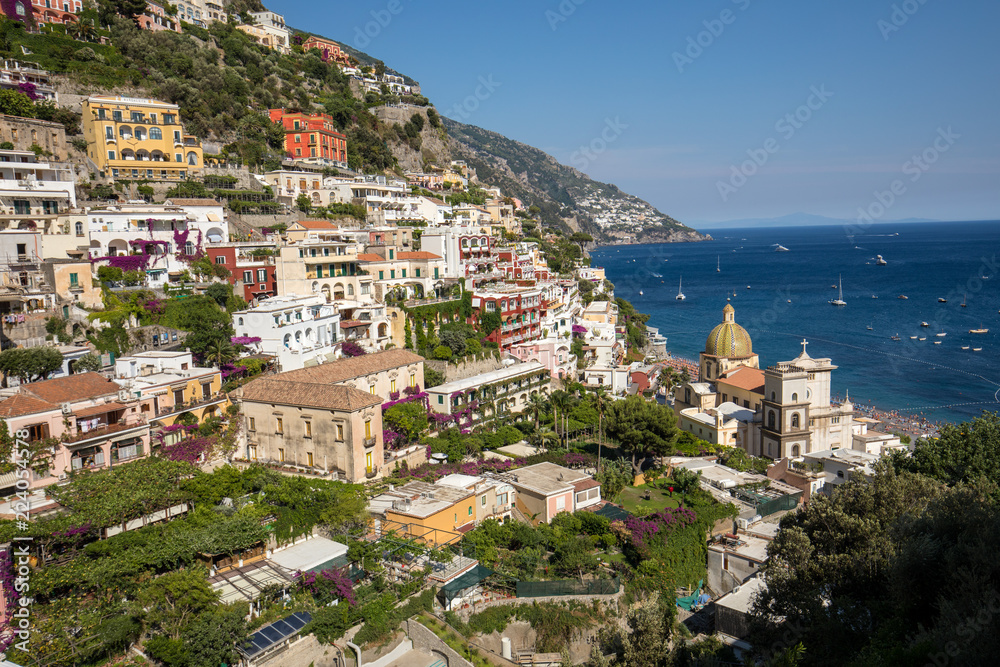 Colourful Positano, the jewel of the Amalfi Coast, with its multicoloured homes and buildings perched on a large hill overlooking the sea. Italy