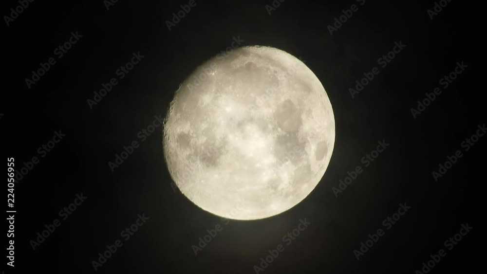 Moon in cloudy night sky. Close up 4k video Moon in cloudy night sky. Close up 4k video