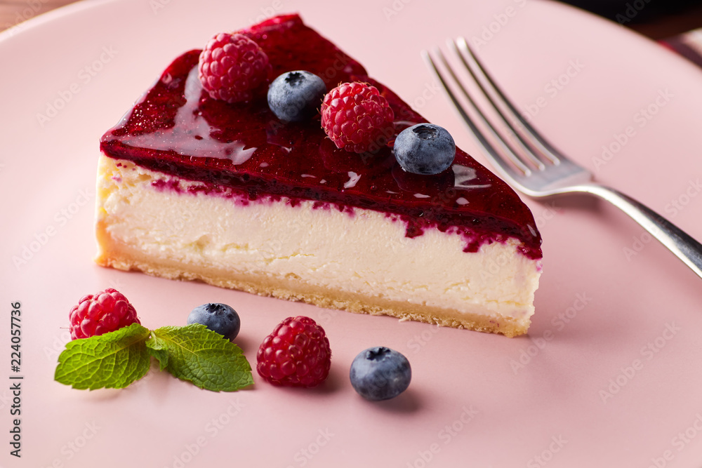 Cheesecake with berries on wooden background Cheesecake with berries on wooden background