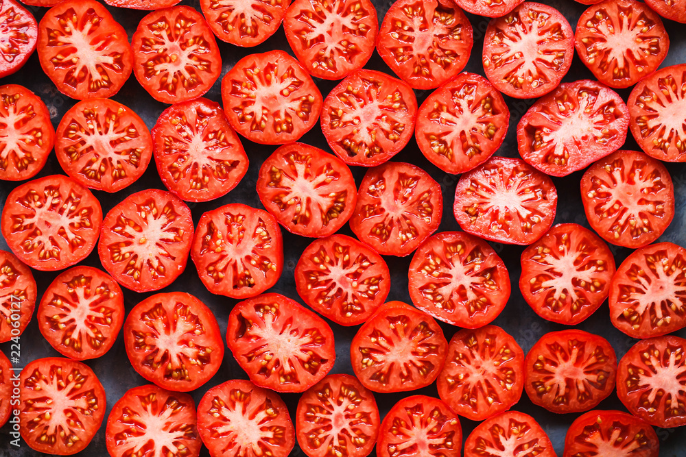 Red tomatoes slices pattern full top view Red tomatoes slices pattern full top view