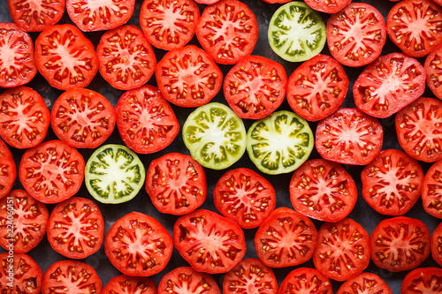 Red tomatoes slices pattern full top view