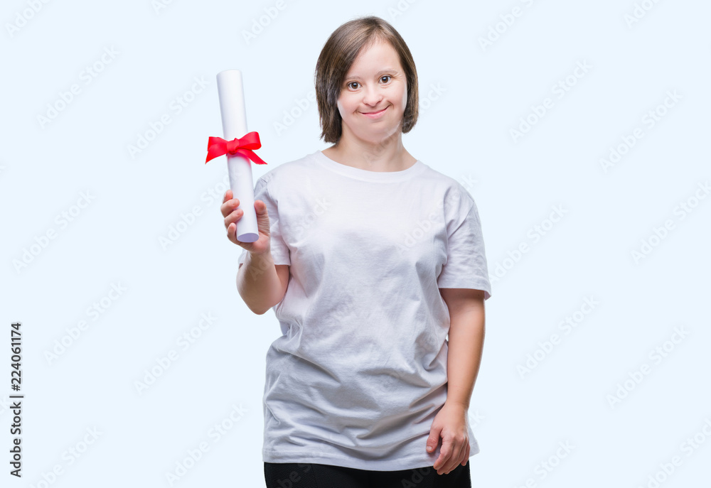 Young adult woman with down syndrome holding degree over isolated background with a happy face standing and smiling with a confident smile showing teeth Young adult woman with down syndrome holding degree over isolated background with a happy face standing and smiling with a confident smile showing teeth