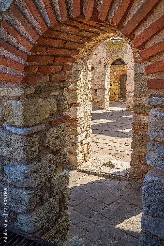 Old city of Nessebar, Black Sea coast, Bulgaria.Detail with ancient arch ruins in Nessebar near Sunny Beach resort.