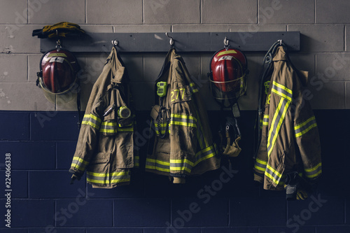Fotografering Firefighter bunker suit in the fire station