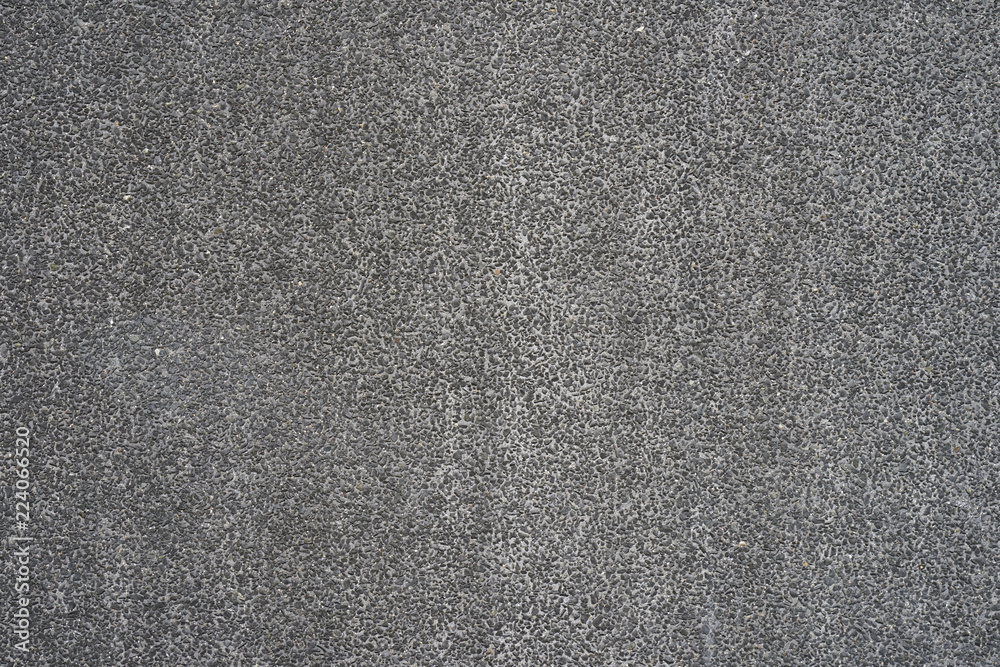 Fototapeta premium Close-up Abstract small stone concrete cement floor texture background. Pebbles texture. Wall of small stones. small stones in the wall,background, unusual texture. Little gray pebbles texture.